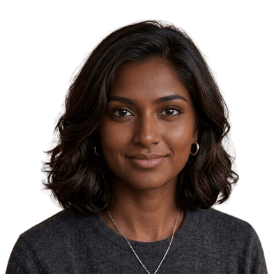 Woman with shoulder-length dark hair wearing a gray sweater on a white background